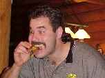Eric stuffs his face at the 2001 Team Christmas Party